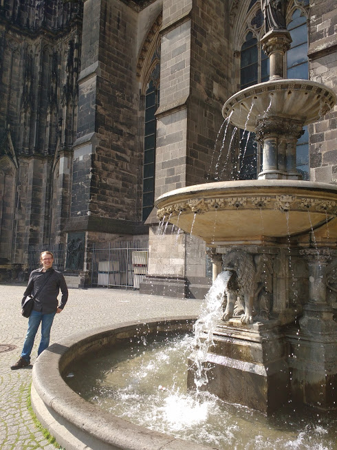 Awkwardly angled photo at Cologne Cathedral to exclude 'intimate' couple on other side of fountain. 